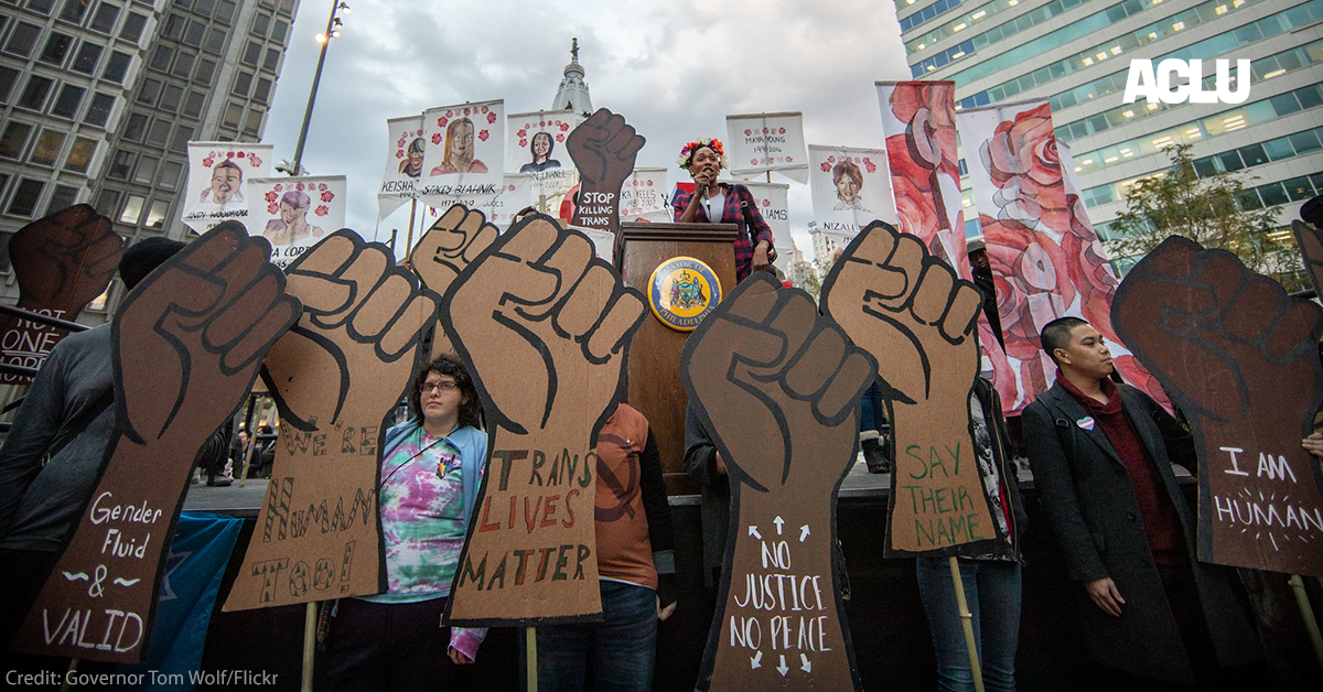 Protesters at rally with signs that read: Black Lives Matter