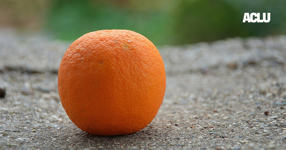 An orange on the ground